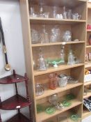 A mixed lot of glass ware including decanters, jugs, coloured glass etc.