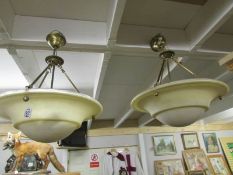 A pair of frosted glass uplighter ceiling lights.