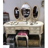 A French style dressing table and stool.