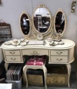 A French style dressing table and stool.