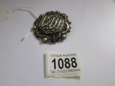 An Islamic/Arab brooch in silver.