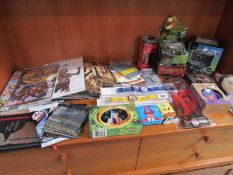 A collection of TV and movie related collectables including Walking Dead, Lord of the Rings,