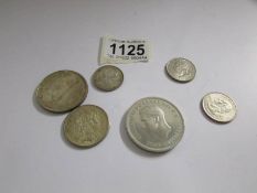 A small collection of coins including US, Canada and 1952 5/-.