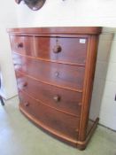 A mahogany 2 over 3 bow front chest of drawers.