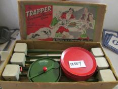 An early 20th century tin plate Trapper greyhound racing game.