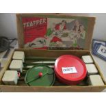 An early 20th century tin plate Trapper greyhound racing game.