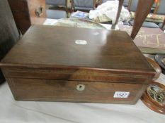 A Victorian writing box with inkwells.