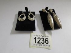 2 pairs of silver pendant earrings (one in a Celtic design).