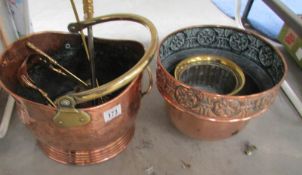 A copper coal scuttle, jardiniere, brass fire irons etc.