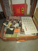 A suitcase containing a large quantity of miscellaneous ephemera including military,
