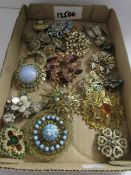 A mixed lot of brooches and earrings, mostly 1950/60s.