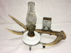 An unusual antler smokers stand oil lamp.