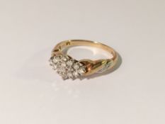 A diamond cluster ring set with 20 diamonds in 9ct gold, size P.