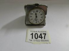 A silver travel clock marked to case 'Brevet', engraved D.J.A Xmas 1935' marked 925.