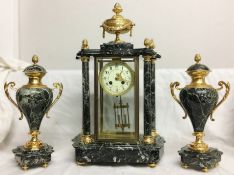An ornate 3 piece clock garniture.
