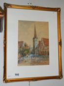 A framed and glazed water colour of a town scene featuring a church (possibly Dutch scene),