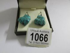 A pair of vintage natural turquoise ear pendants.