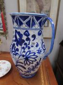 A large blue and white jug.