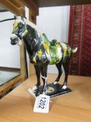 A Chinese Tang style pottery horse.
