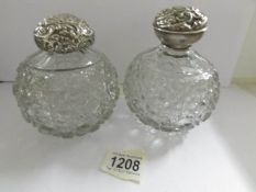 2 large cut glass scent bottles with silver tops, a/f.