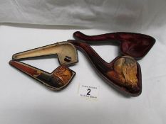 A cased Meerscham pipe in fair condition and another cased pipe a/f.