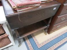 An oak tea trolley.