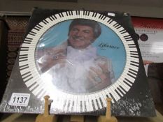 A rare Liberace picture disc, new and unopened.