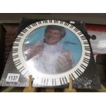 A rare Liberace picture disc, new and unopened.