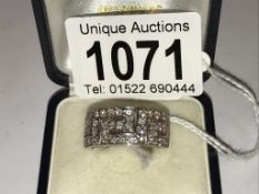 An 18ct white gold diamond set key design ring set with 50 diamonds, size N half.