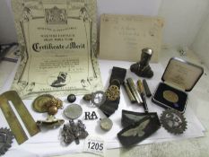 A mixed lot of military items including badges, medallions, bust etc.