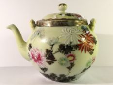 A hand decorated Chinese porcelain teapot.