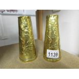 A pair of French engraved brass vases.