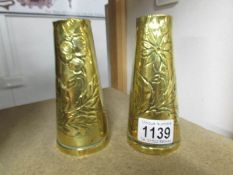 A pair of French engraved brass vases.
