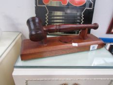 An auctioneer's gavel on stand.