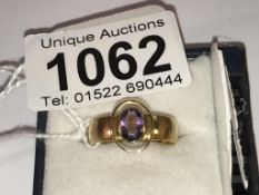 A 22ct gold ring set with an oval amethyst, hall marked Birmingham 1918, size N.