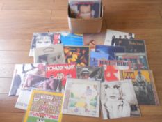 Approximately 60 pop and rock LP records.