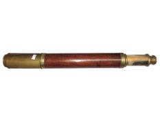 A brass and mahogany telescope marked 'Davis, London, Day & Night'.