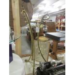 A brass 3 legged pot stand.