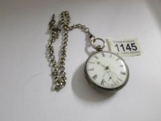 A Silver pocket watch, London 1934/35 on silver pocket watch chain with T bar and crab claw.