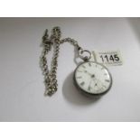 A Silver pocket watch, London 1934/35 on silver pocket watch chain with T bar and crab claw.