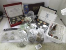A box of mainly UK and Ireland coins including coin sets and 2 empty cases.