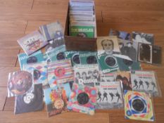 Approximately 100 Beatles single and EP records including 69 Beatles, 15 John Lennon,