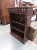 A mahogany book case.