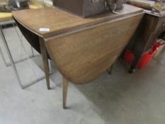 An oak drop leaf table.