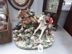 A finely made figure group of a hunting scene with horses and dogs.