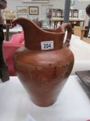 A large earthen ware jug,