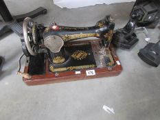 A Singer sewing machine, missing cover.