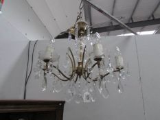 A 6 lamp chandelier.