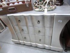 A silver coloured 3 drawer chest,.