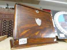 An oak desk top stationary box.